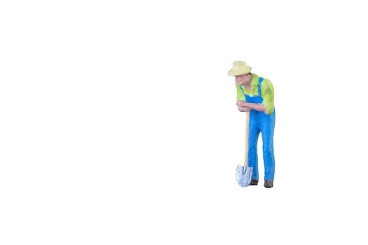 Close up of Miniature farmer people isolated with clipping path on white background . Elegant Design with copy space for placement your text, mock up for farmer and gradening concept