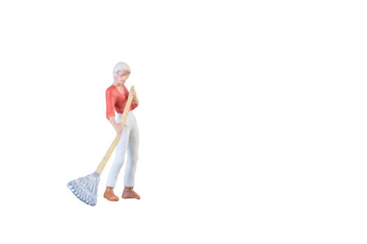 Close up of Miniature farmer people isolated with clipping path on white background . Elegant Design with copy space for placement your text, mock up for farmer and gradening concept.