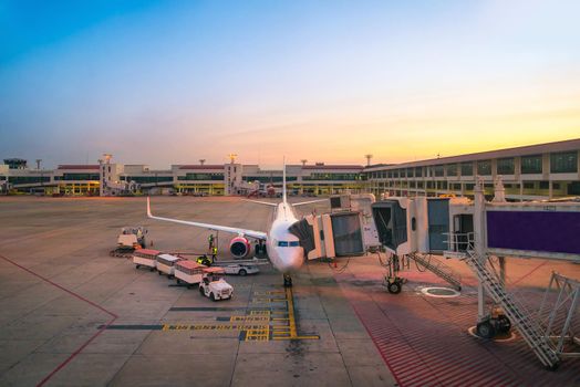 Airport ramp service for for a commercial plane landing at Suvarnabhumi International Airport in Bangkok,Thailand