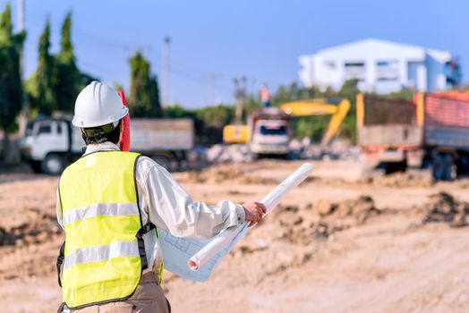 Asian construction engineer checking construction site for new Infrastructure project. photo concept for engineering work.