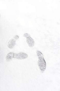Footprint on fresh white snow falling at public park in winter season in Tokyo,Japan. Elegant design with copy space for add your text or art work