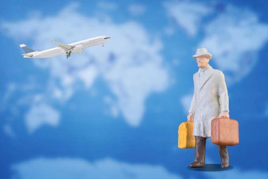 Miniature businessman and tourist people in airport with flight flying over world map background. Elegant Design with copy space for placement your text, mock up for business and travel concept.