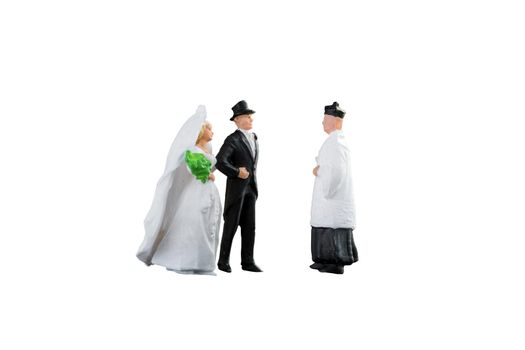 Close up of Miniature people wedding bride and groom couple isolated with clipping path on white background.Elegant Design with copy space for placement your text, mock up for love and wedding concept