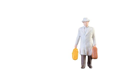 Close up of Miniature businessman and tourist people isolated with clipping paht on white background.Elegant Design with copy space for placement your text, mock up for business and travel concept