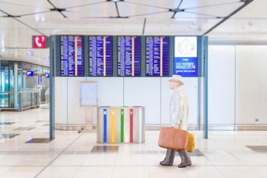 Close up of Miniature businessman and tourist people in national airport on white background.Elegant Design with copy space for placement your text, mock up for business and travel concept