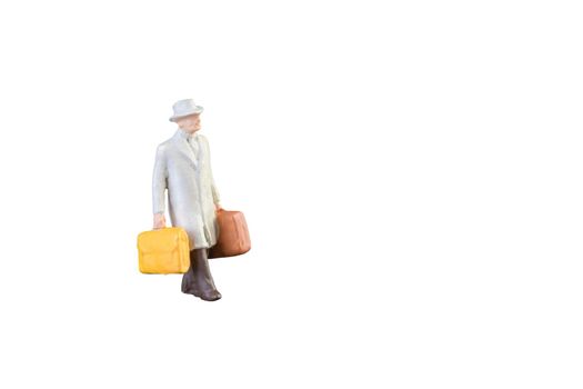 Close up of Miniature businessman and tourist people isolated with clipping path on white background.Elegant Design with copy space for placement your text, mock up for business and travel concept