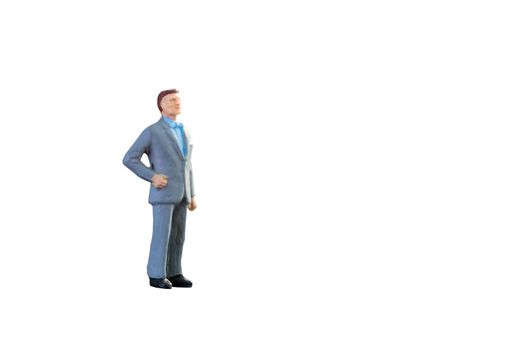 Close up of Miniature businessman and tourist people isolated with clipping path on white background.Elegant Design with copy space for placement your text, mock up for business and travel concept.