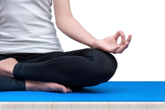 Young woman keep calm and meditates while practicing yoga to explore the Inner Peace. Yoga and meditation have good benefits for health. Photo concept for Yoga Sport and Healthy lifestyle.