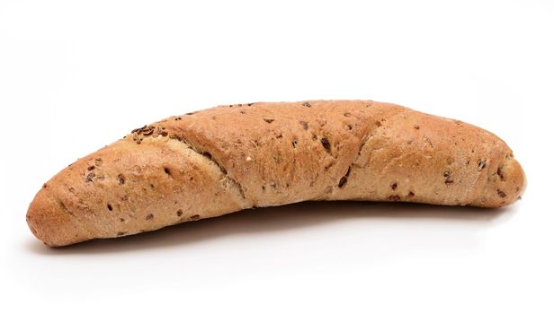 Baked whole grain bread roll on white background.