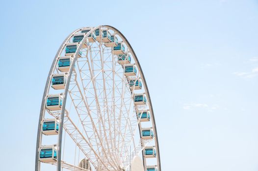 Close up Giant Ferris Wheel in Hong Kong near Victoria Harbor with clear sky background,Hong Kong 