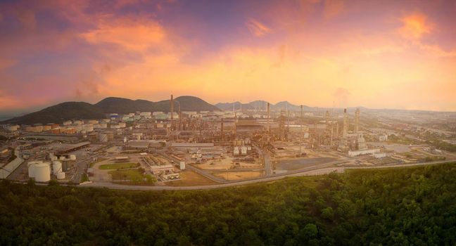 Ariel panorama view of oil and gas refinery plant of petroleum or petrochemical industry production with sunrise sky environment 