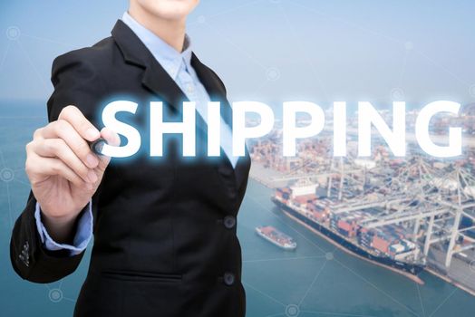 Smart Business woman is writing shipping concept with shipping boat at shipping yard in background for Global business container cargo shipping,Logistic,Import and Export business concept.