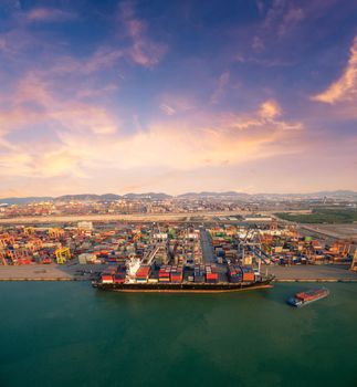 Large container shipping boat at shipping yard main transportation of cargo container  shipping. Photo concept for Global business shipping,Logistic,Import and Export industry.