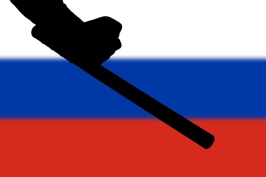 hand with police tonfa rubber stick silhouette and blurry russian flag in the background - violent riot control concept