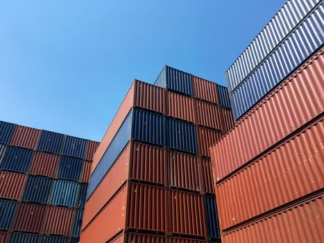 Colourful stack pattern of cargo shipping containers in shipping yard,dock yard for transportation,import,export industrial concept