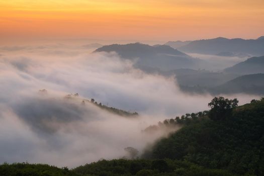 Amazing nature mist moving over the nature mountains during sunrise in morning time