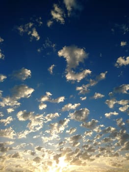 Clouds in the morning sunlight against the blue sky.