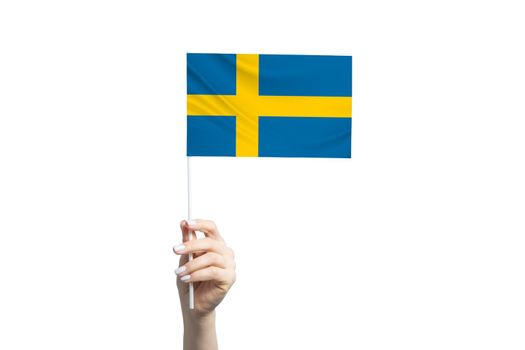 Beautiful female hand holding Sweden flag, isolated on white background.