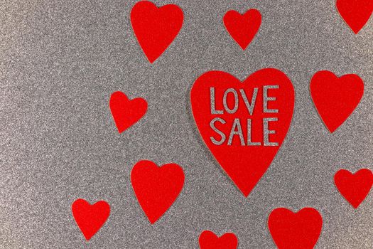 Saint Valentine's day love sale red hearts on silver background design