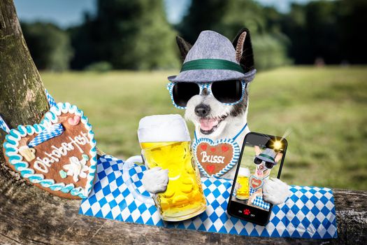 bavarian poodle  dog taking a selfie holding  a beer mug  outdoors by the river and mountains  , ready for the beer party celebration festival in munich