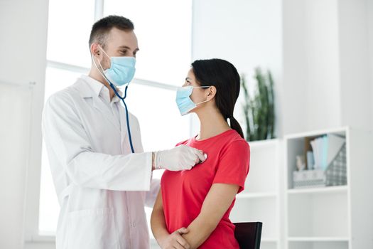 patient being examined by a doctor with a stethoscope in a hospital. High quality photo