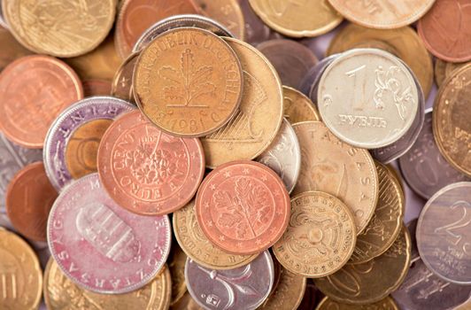 Coins of different countries on a white background