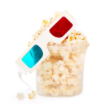Paper striped bucket with popcorn and 3D glasses isolated on white background with clipping path.