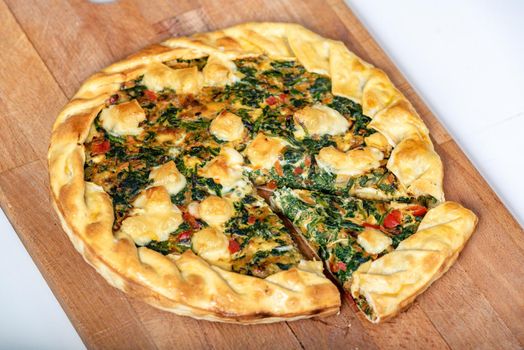 Vegetable Tart, puff pastry, chard, carrot, onion, garlic and red peppers.