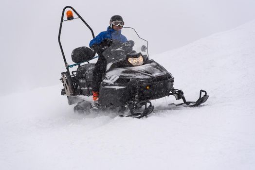Grandvalira, Andorra: 2021 January 03: Ski Patrol in snowmobile in the Pyrenees at the Grandvalira ski resort in Andorra in Covid19 time