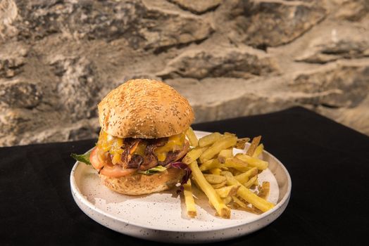 Arinsal, Andorra: 2020 December 2: California burger served with French fries.