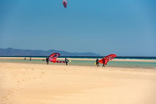 Sotavento, Fuerteventura, Spain: 2020 October 8: Man practicing kitesurfing in Playa de Sotavento, Fuerteventura in Spain in summer.