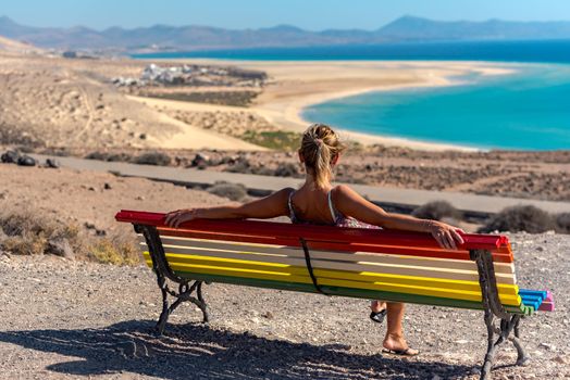 Young blonde woman on Sotavento Beach, Fuerteventura in Spain.
