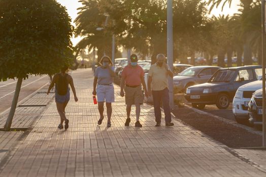 Morro Jable, Fuerteventura, Spain: 2020 October 08: People walking in the time of COVID 19 Morro Jable on the Island of Fuerteventura in Spain in the summer of 2020.
