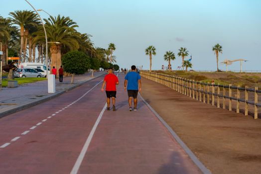Morro Jable, Fuerteventura, Spain: 2020 October 08: People walking in the time of COVID 19 Morro Jable on the Island of Fuerteventura in Spain in the summer of 2020.