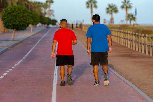Morro Jable, Fuerteventura, Spain: 2020 October 08: People walking in the time of COVID 19 Morro Jable on the Island of Fuerteventura in Spain in the summer of 2020.