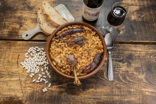 French specialty: cassoulet, a meal with white beans, duck leg, sausage and bacon.