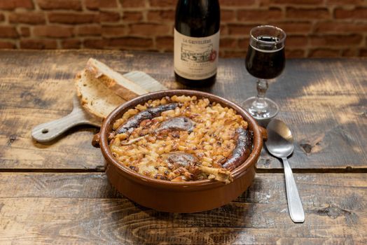 French specialty: cassoulet, a meal with white beans, duck leg, sausage and bacon.