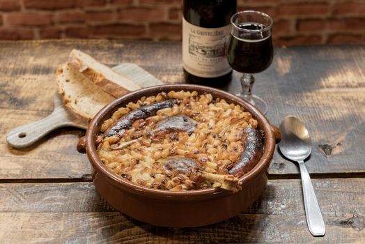 French specialty: cassoulet, a meal with white beans, duck leg, sausage and bacon.