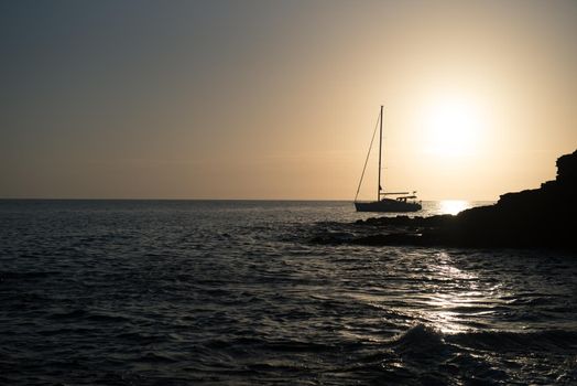 Boat at sunset in the Atlantic Sea on the Island of Fuerteventura in Spain.