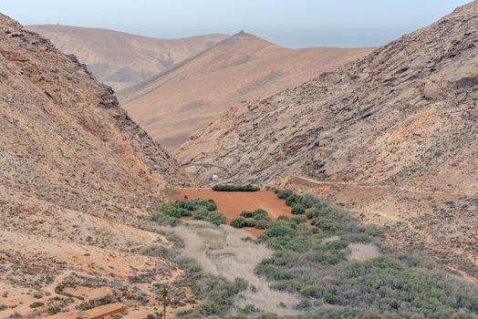 Barranco and Ermita de las Peñitas on the way from Bentacoria to Pajara on the island of Fuerteventura, Spain.