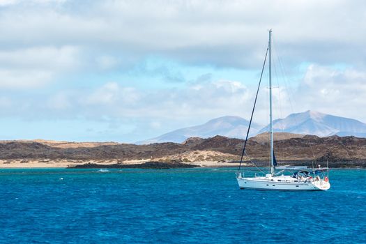 Corralejo, Fuerteventura, Spain: 2020 September 30: Boat in the sea near Corralejo in Fuerteventura in the Canary Islands in Spain.