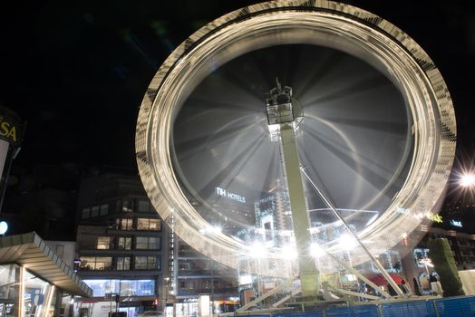 Andorra la Vella, Andorra : 2020 October 30 : Ferris wheel in the City of Andorra La Vella, capital of Andorra in the Pyrenees in autumn 2020.