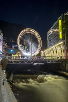 Andorra la Vella, Andorra : 2020 October 30 : Ferris wheel in the City of Andorra La Vella, capital of Andorra in the Pyrenees in autumn 2020.