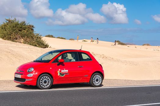 Corralejo, Fuerteventura, Spain: 2020 October 30: Rental car in the Dunas de Corralejo Natural Park in Fuerteventura, Spain in the fall of 2020.
