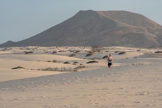 Corralejo, Fuerteventura, Spain: 2020 September 30: People in the dunes at the Parque Natual Dunas de Corralejo on Fuerteventura on the Canary Islands in Spain.