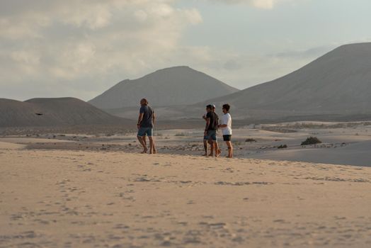 Corralejo, Fuerteventura, Spain: 2020 September 30: People in the dunes at the Parque Natual Dunas de Corralejo on Fuerteventura on the Canary Islands in Spain.