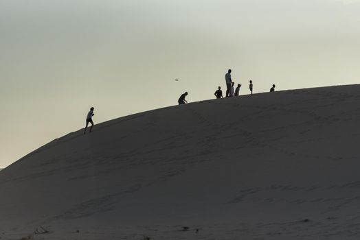 Corralejo, Fuerteventura, Spain: 2020 September 30: People in the dunes at the Parque Natual Dunas de Corralejo on Fuerteventura on the Canary Islands in Spain.