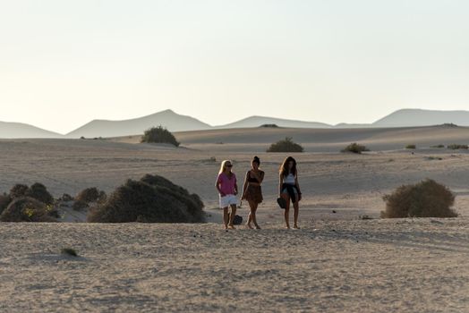 Corralejo, Fuerteventura, Spain: 2020 September 30: People in the dunes at the Parque Natual Dunas de Corralejo on Fuerteventura on the Canary Islands in Spain.