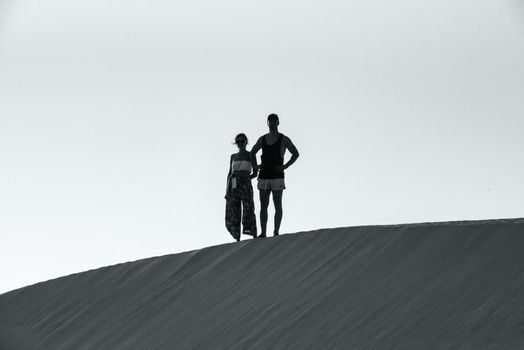 Corralejo, Fuerteventura, Spain: 2020 September 30: People in the dunes at the Parque Natual Dunas de Corralejo on Fuerteventura on the Canary Islands in Spain.