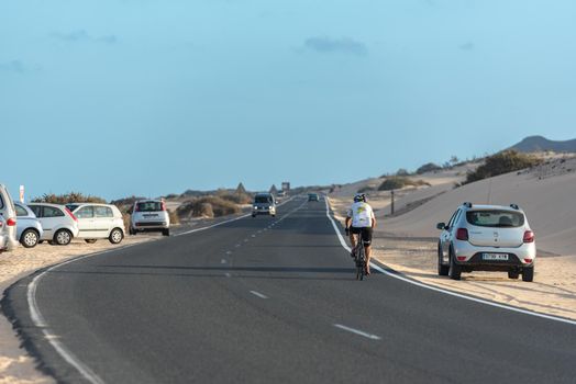 Corralejo, Fuerteventura, Spain: 2020 September 30: Cars on the route in the Parque Natual Dunas de Corralejo on Fuerteventura on the Canary Islands in Spain.
